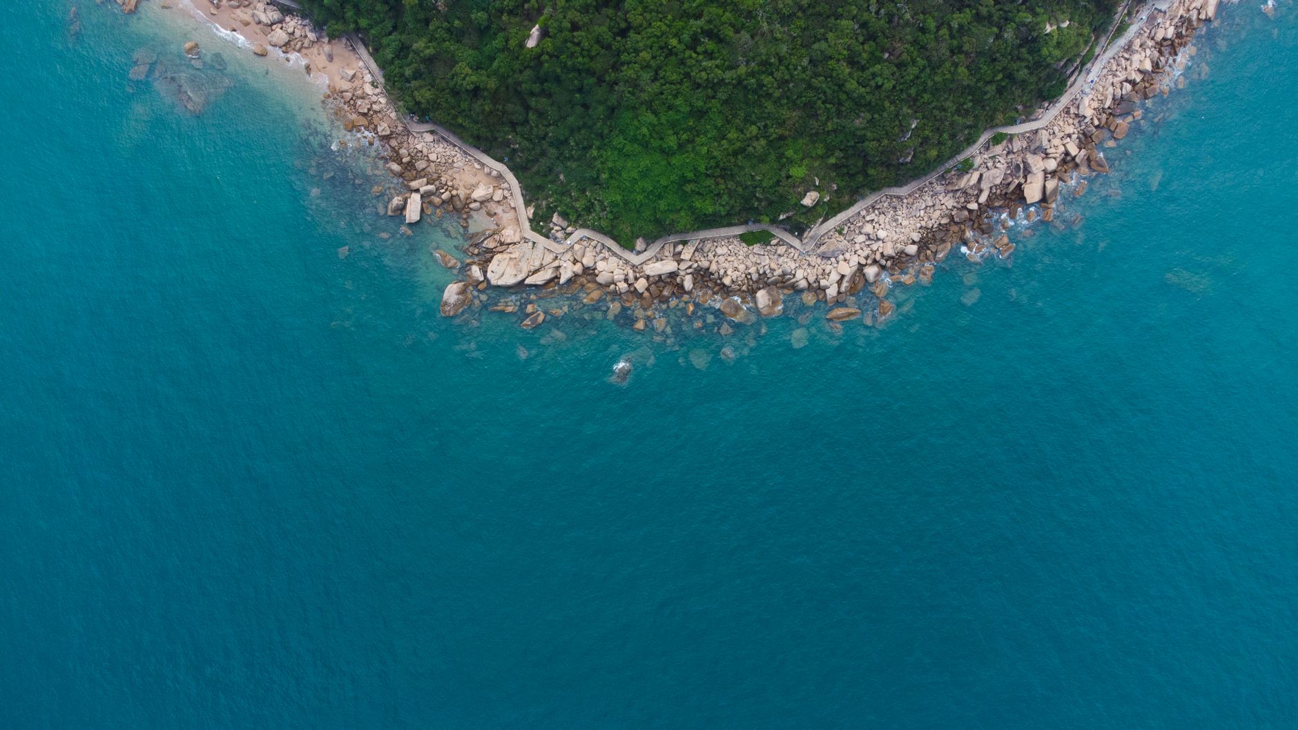 Aerial drone footage over a rocky coastline
